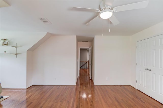 4246 Stilson Cir, Peachtree Corners, GA 30092 - unfurnished living room with baseboards, wood finished floors, and a ceiling fan