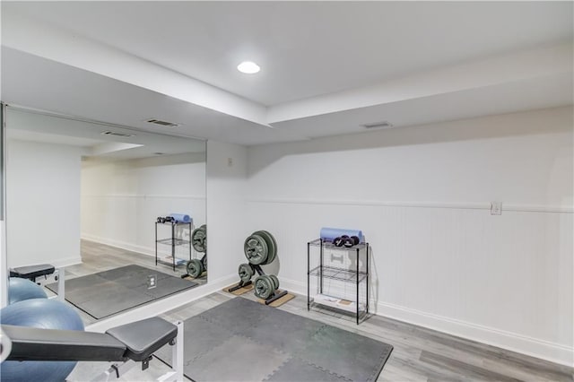4246 Stilson Cir, Peachtree Corners, GA 30092 - exercise room with wood finished floors, baseboards, and a wainscoted wall