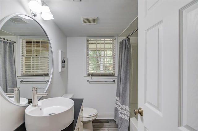 4246 Stilson Cir, Peachtree Corners, GA 30092 - full bathroom featuring toilet, vanity, baseboards, and wood finished floors
