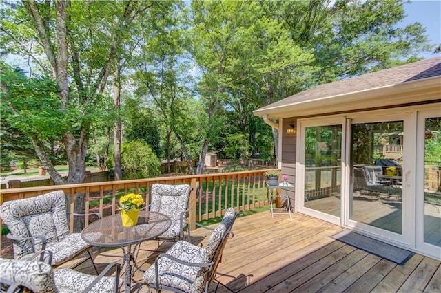 4246 Stilson Cir, Peachtree Corners, GA 30092 - wooden terrace featuring a fenced backyard, outdoor dining space, and view of scattered trees