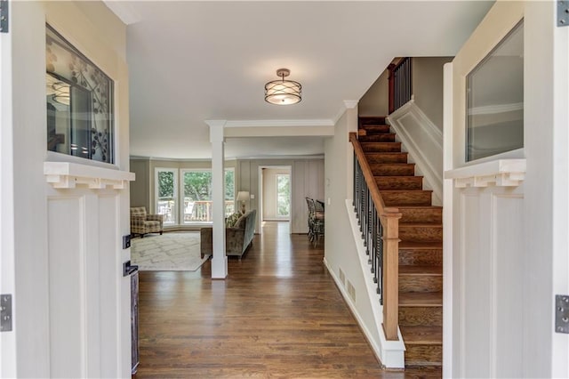 4246 Stilson Cir, Peachtree Corners, GA 30092 - foyer featuring dark wood-type flooring, stairway, and crown molding