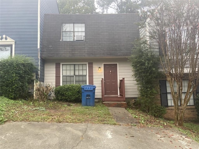 view of front of house with a shingled roof