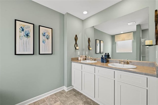 bathroom with tile patterned floors and double vanity