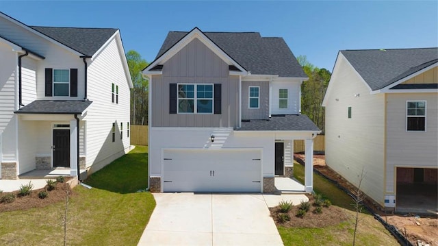 12000 Conrad, Hampton, GA 30228 - view of front of property with board and batten siding, a garage, concrete driveway, and a front lawn