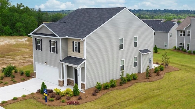 exterior space featuring a garage and a lawn