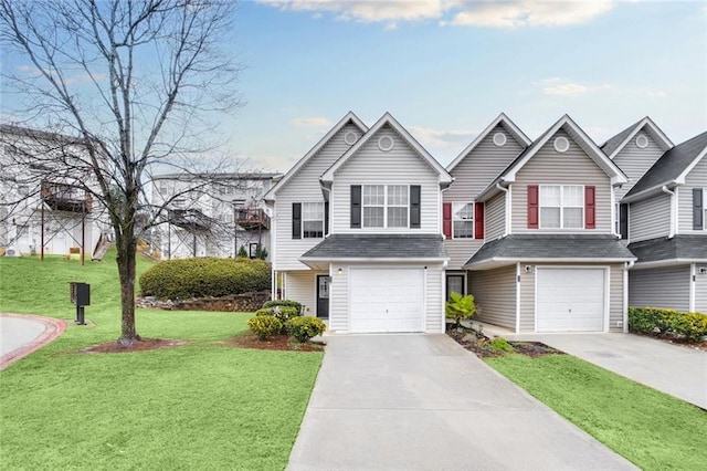 view of front of house featuring a front lawn, a garage, and driveway