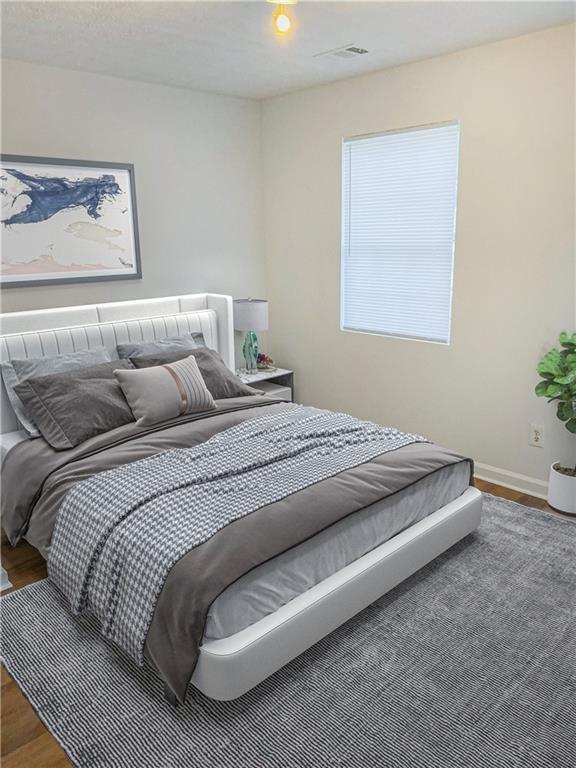 bedroom featuring hardwood / wood-style floors