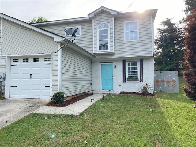 view of front of house featuring a front yard and a garage