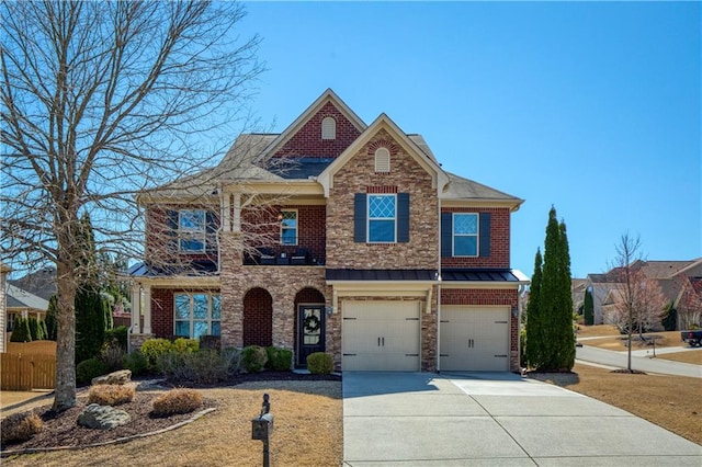 view of front facade featuring brick siding, concrete driveway, a garage, and fence