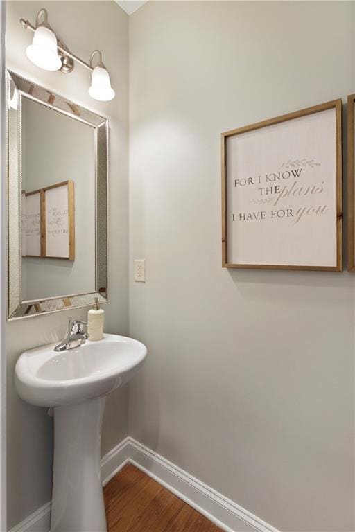 bathroom featuring baseboards and wood finished floors