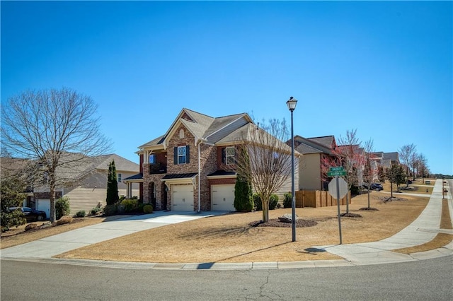 view of front of home with concrete driveway, an attached garage, and brick siding