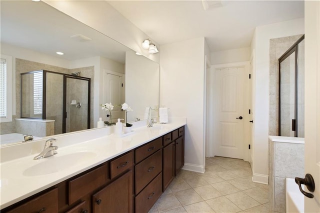 bathroom featuring a sink, a shower stall, tile patterned flooring, double vanity, and a bath