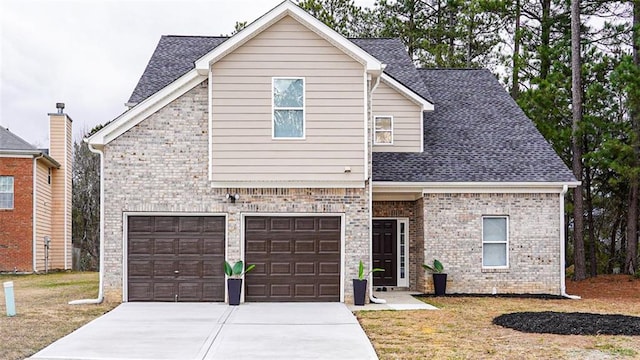 view of front facade featuring a garage and a front yard