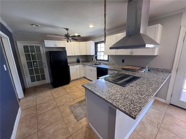 kitchen featuring sink, island range hood, black appliances, white cabinets, and kitchen peninsula