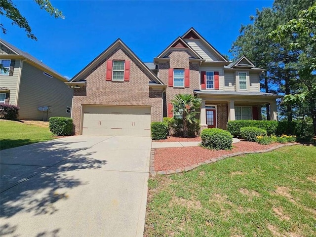 1021 Rock Elm Dr, Auburn, GA 30011 - craftsman house featuring brick siding, a garage, concrete driveway, and a front yard