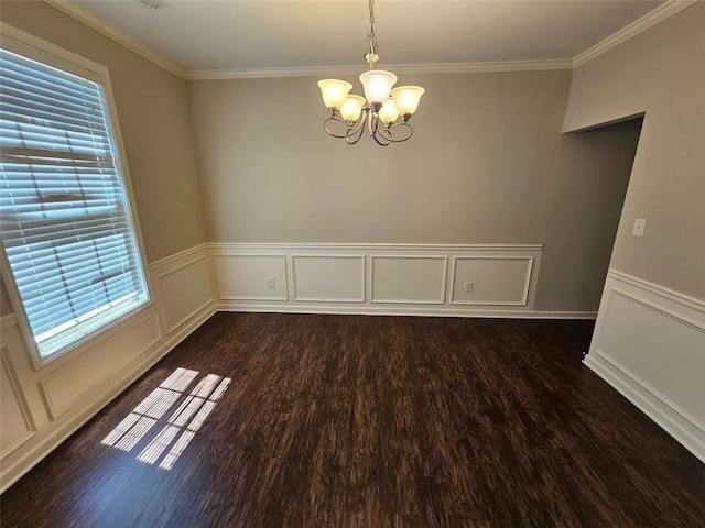 1021 Rock Elm Dr, Auburn, GA 30011 - empty room with a chandelier, dark wood finished floors, ornamental molding, a wainscoted wall, and a decorative wall