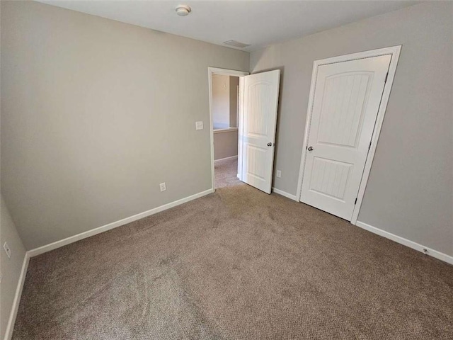 1021 Rock Elm Dr, Auburn, GA 30011 - unfurnished bedroom with carpet floors and baseboards