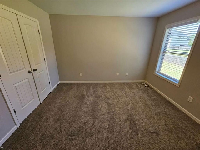1021 Rock Elm Dr, Auburn, GA 30011 - unfurnished bedroom featuring carpet, baseboards, and a closet