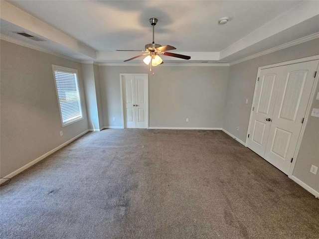 1021 Rock Elm Dr, Auburn, GA 30011 - carpeted empty room featuring a tray ceiling, a ceiling fan, baseboards, and crown molding