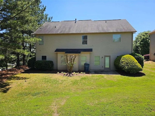 1021 Rock Elm Dr, Auburn, GA 30011 - back of property with a lawn and a patio