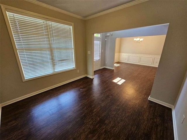 1021 Rock Elm Dr, Auburn, GA 30011 - unfurnished room with crown molding, wood finished floors, a chandelier, and baseboards