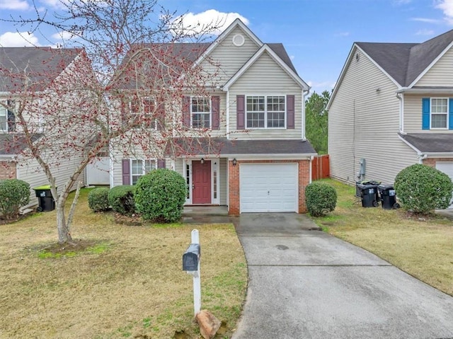 view of front of home featuring a garage and a front yard