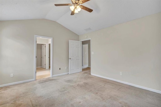 unfurnished bedroom with vaulted ceiling, light carpet, and ceiling fan