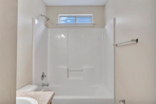 full bathroom featuring vanity, shower / bathtub combination, and toilet