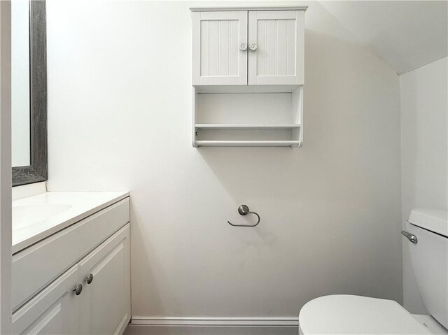 half bath with vanity and toilet