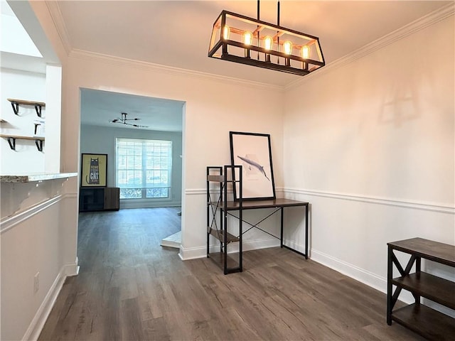 corridor with dark wood-style flooring, crown molding, and baseboards