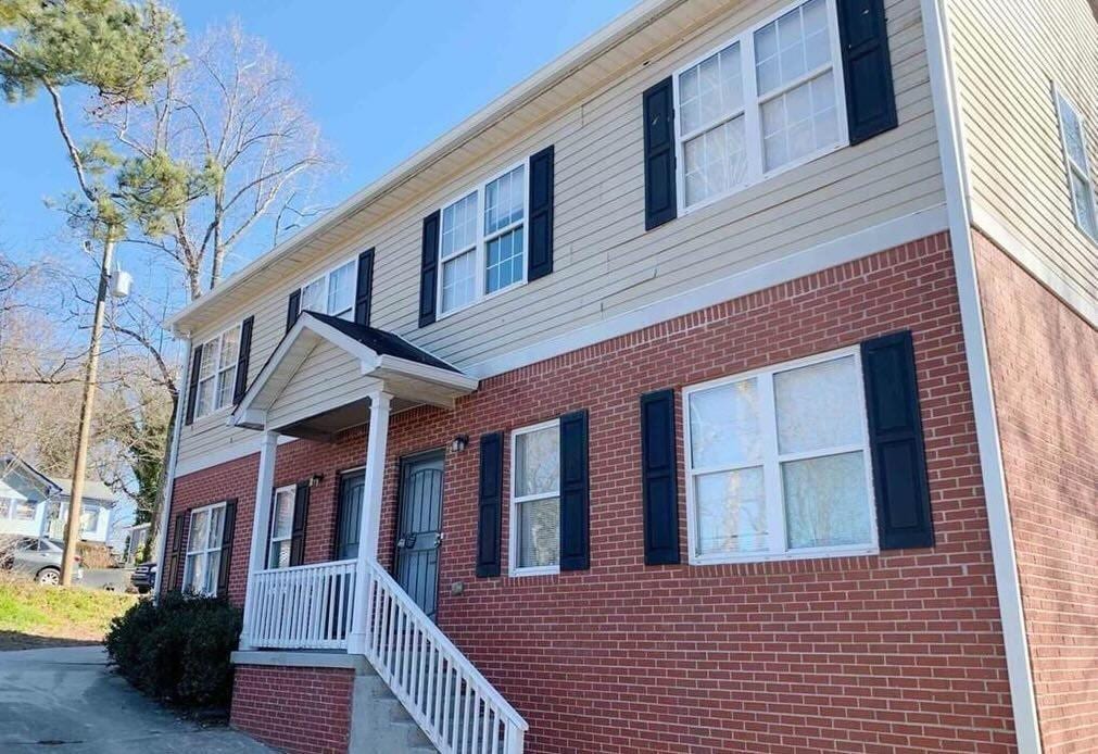 exterior space with brick siding