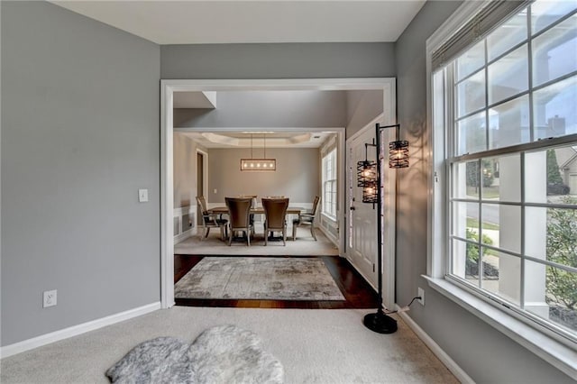 450 Hilingdon Way, Suwanee, GA 30024 - entryway with dark carpet, a chandelier, baseboards, and dark wood finished floors