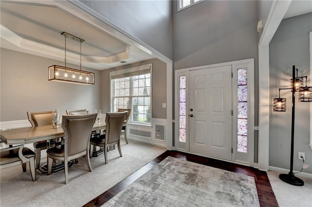 450 Hilingdon Way, Suwanee, GA 30024 - foyer entrance with a tray ceiling, dark wood finished floors, and a wainscoted wall
