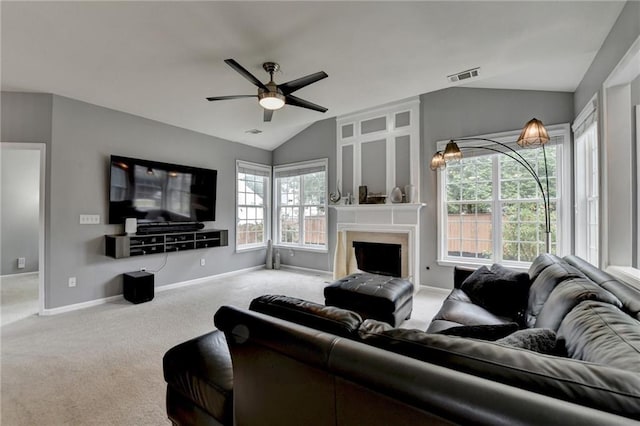 450 Hilingdon Way, Suwanee, GA 30024 - carpeted living area featuring vaulted ceiling, baseboards, ceiling fan, and a large fireplace