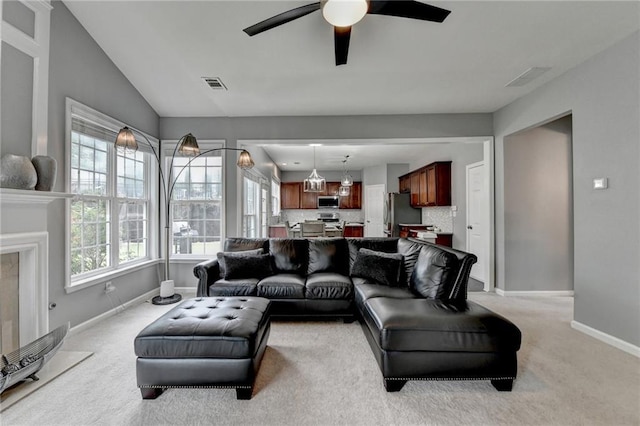 450 Hilingdon Way, Suwanee, GA 30024 - living area with light carpet, baseboards, ceiling fan, and lofted ceiling