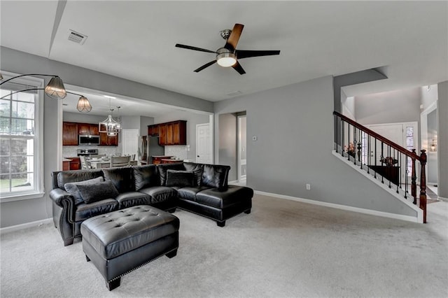 450 Hilingdon Way, Suwanee, GA 30024 - living room featuring light colored carpet, baseboards, and ceiling fan