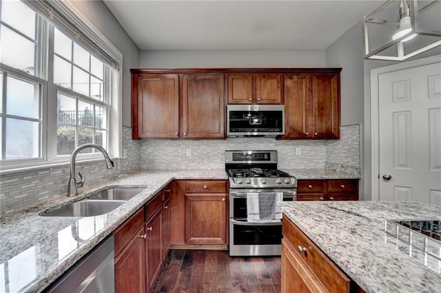 450 Hilingdon Way, Suwanee, GA 30024 - kitchen featuring appliances with stainless steel finishes, a sink, dark wood finished floors, and light stone countertops