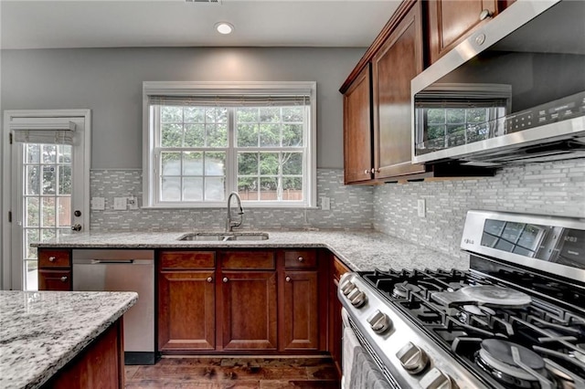 450 Hilingdon Way, Suwanee, GA 30024 - kitchen with appliances with stainless steel finishes, a sink, light stone counters, and tasteful backsplash