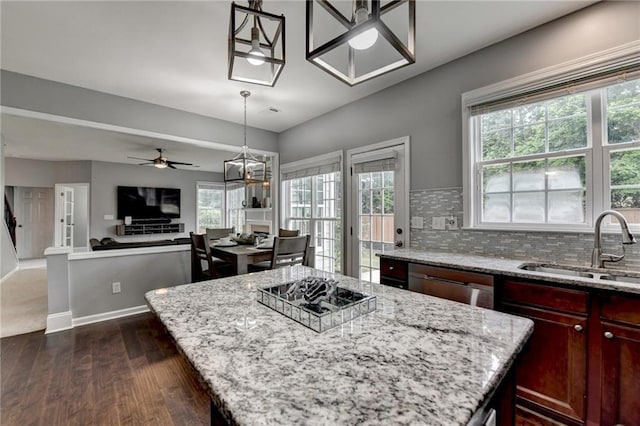 450 Hilingdon Way, Suwanee, GA 30024 - kitchen featuring a sink, dark wood-style flooring, light stone countertops, a ceiling fan, and backsplash