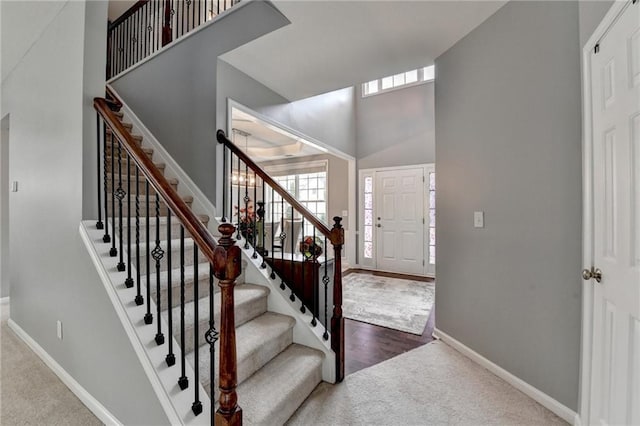 450 Hilingdon Way, Suwanee, GA 30024 - foyer entrance featuring carpet, baseboards, a towering ceiling, and stairway
