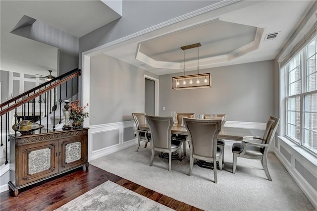 450 Hilingdon Way, Suwanee, GA 30024 - dining room with wood finished floors, a tray ceiling, stairway, a decorative wall, and wainscoting