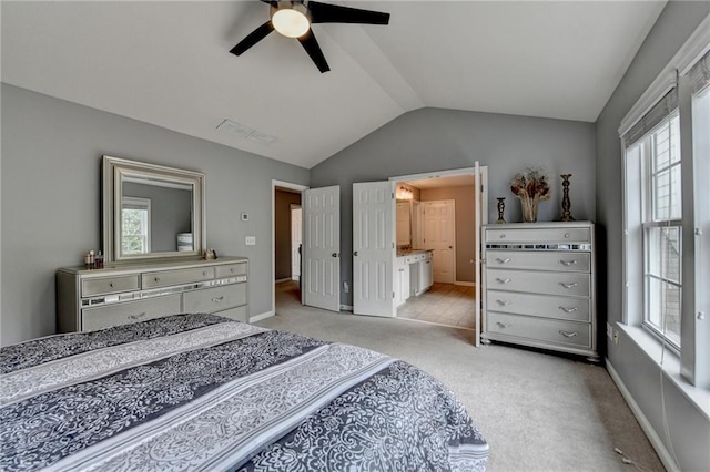 450 Hilingdon Way, Suwanee, GA 30024 - bedroom with lofted ceiling, multiple windows, carpet floors, a ceiling fan, and connected bathroom