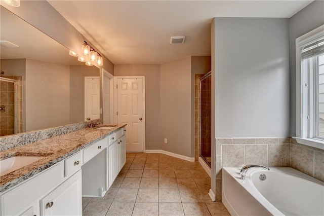 450 Hilingdon Way, Suwanee, GA 30024 - bathroom with double vanity, a stall shower, plenty of natural light, and a garden tub
