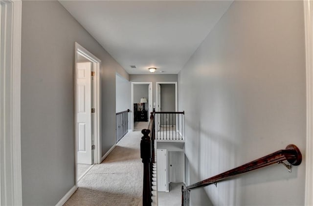 450 Hilingdon Way, Suwanee, GA 30024 - corridor with an upstairs landing, carpet flooring, and baseboards