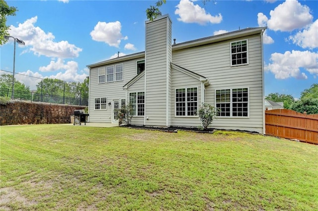 450 Hilingdon Way, Suwanee, GA 30024 - rear view of house featuring a patio and a chimney