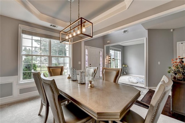 450 Hilingdon Way, Suwanee, GA 30024 - dining area featuring a chandelier, a tray ceiling, carpet flooring, and crown molding