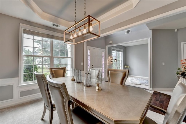 450 Hilingdon Way, Suwanee, GA 30024 - dining space featuring a chandelier, healthy amount of natural light, a raised ceiling, carpet flooring, and crown molding