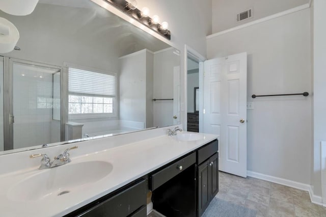 bathroom with vanity and independent shower and bath