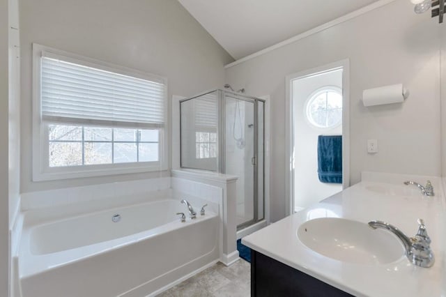 bathroom with tile patterned flooring, vanity, lofted ceiling, and plus walk in shower