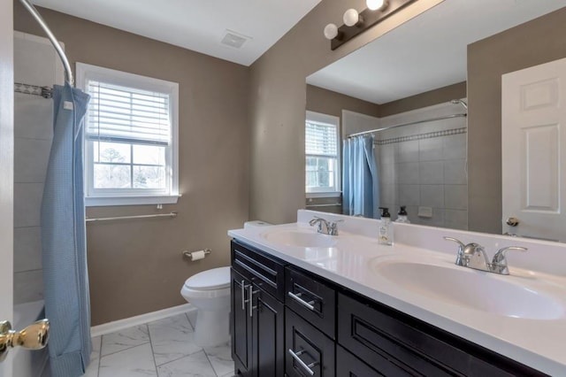 full bathroom with vanity, toilet, and shower / bath combo